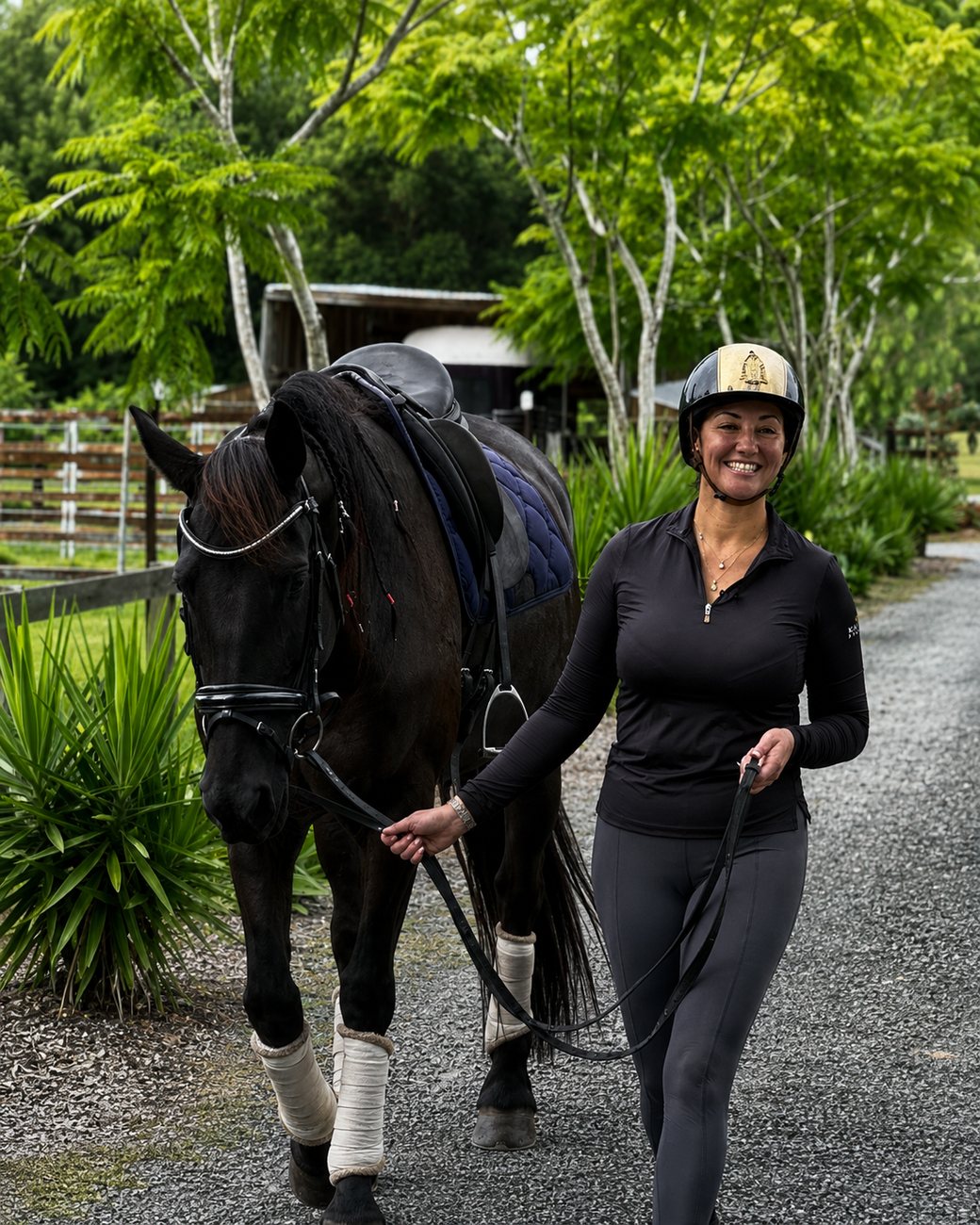 Natasha Althoff walking a horse back from the arena Natasha Althoff walking a horse back from the arena