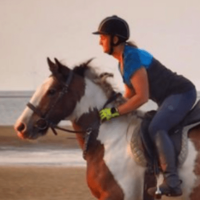 Sam Taylor-Leighton galloping on the beach