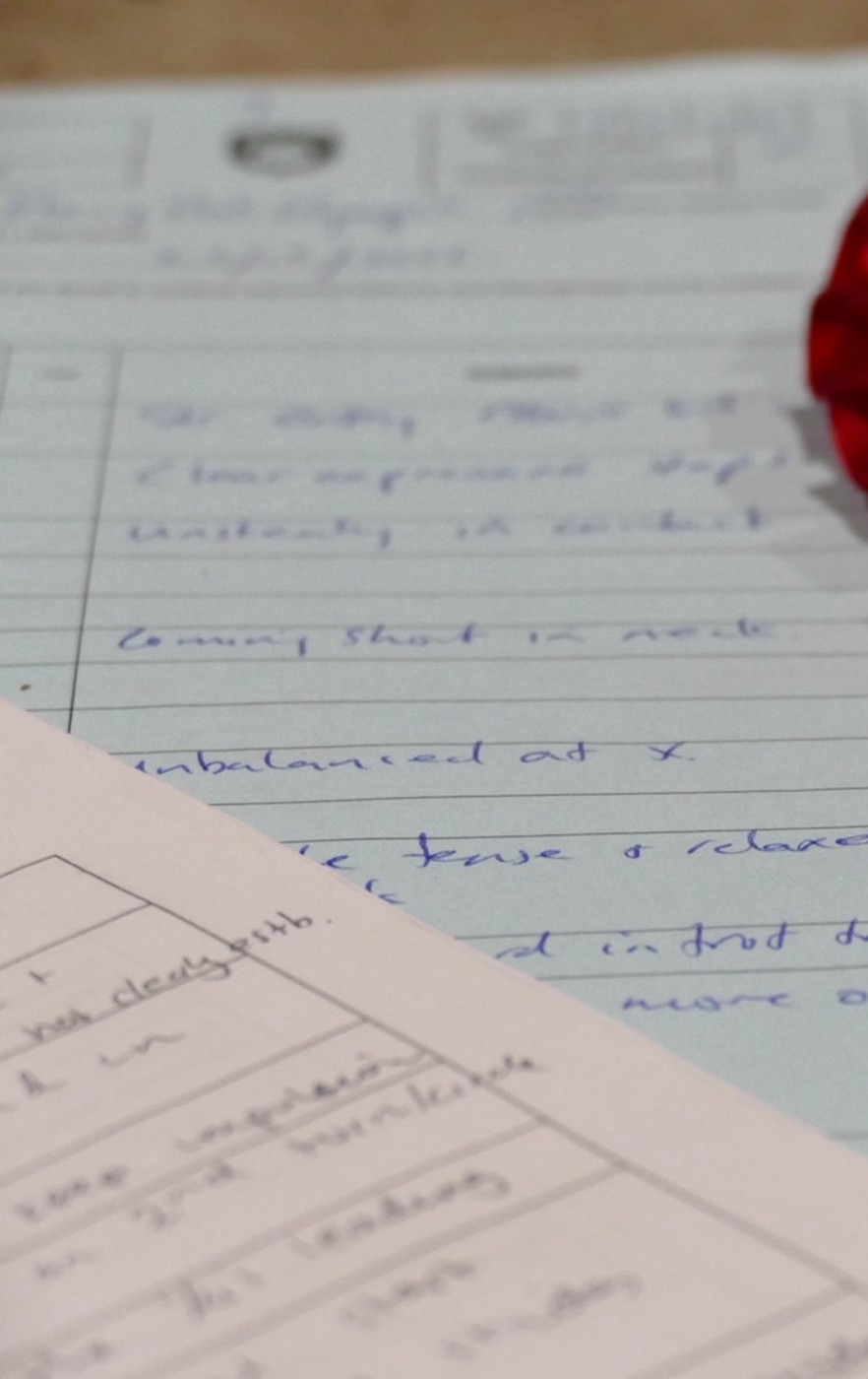 A dressage test sheet covered in handwritten judge's comments